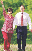Britains Prime MinisterTony Blair and his wife Cherie arrive at their local polling station in Trimdon to cast their vote for the general election on Thursday.