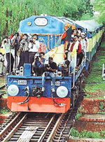 The first passenger special train enters India from Darshana station in Bangladesh territory as journalists ride on its engine at Jaynagar, near Gede station, Nadia district, about 117 km north of Calcutta, on Wednesday. 