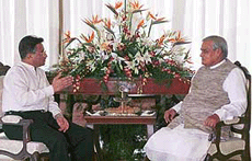 Pakistan President General Pervez Musharraf making a point intently to Prime Minister Atal Behari Vajpayee before the two began their summit in Jaypee Palace Hotel in Agra on Sunday. 