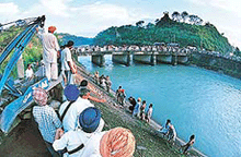 Rescue operations in progress near a canal where a truck fell down which was carrying pilgrims at Kiratpur Sahib in Ropar district on Monday.