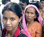 Munni Devi and her mother leave after addressing a Press conference in New Delhi on Friday. 