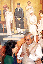 Prime Minister Atal Behari Vajpayee with Congress President Sonia Gandhi after unveiling a painting "Transfer of Power" by V.S. Kulkarni at Parliament House annexe in New Delhi on Tuesday.
