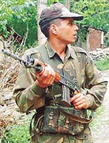 A soldier takes up position during a search operation.