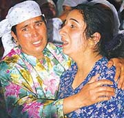 Relatives wail over the death of Fayaz Ahmad Dharma, zonal commander of the Harkat-ul- Mujahideen.