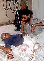 A boy wounded in an encounter between militants and security forces at Khansahib area of central Kashmir on Wednesday undergoes treatment in a Srinagar hospital on Thursday.