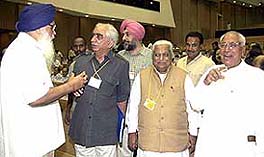 External Affairs Minister Jaswant Singh has a word with Punjab Chief Minister Parkash Singh Badal while Haryana Chief Minister Om Prakash Chautala and Gujarat Chief Minister Keshubhai Patel look on.