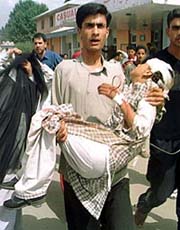 A man rushes an injured girl to hospital.