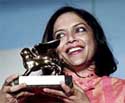 Indian director Mira Nair holds her Golden Lion for the best film.