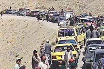 Vehicles line up at a Pakistani checkpost 