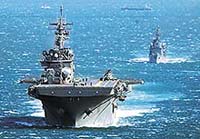 The US amphibious assault vessel Essex sails off the Sasebo naval base, southwestern Japan, on Saturday for an undisclosed destination.