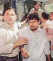 Activists of the Students Islamic Movement of India (SIMI) are brought to a court