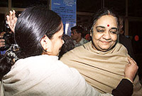 Malni Nambiar (right), wife of Indias High Commissioner to Pakistan Vijay Nambiar, is hugged by a wellwisher at Islamabad International airport before boarding a flight back to India on Saturday.