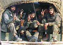 Indian soldiers flash victory signs