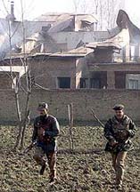 Soldiers run for cover after they were fired upon by suspected militants