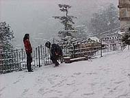 Shimla town wears a white mantle on Friday