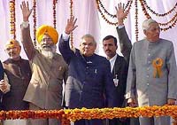 The Prime Minister, Mr Atal Behari Vajpayee, waves to the crowd at an election rally at Bathinda on Sunday. Also in the picture are Mr Sukhdev Singh Dhindsa and Mr Chiranji Lal Garg.
