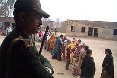 A BSF man keeps vigil at the re-polling in Valtoha constituency