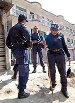 The Nepalese police guards office buildings in Kathmandu
