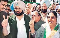 Capt Amarinder Singh and Mrs Rajinder Kaur Bhattal are all smiles as they greet the newly elected party legislators at Punjab Bhavan in Chandigarh on Monday.
