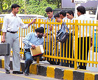 Squeezing through the broken railings is a common sight in the Capital.