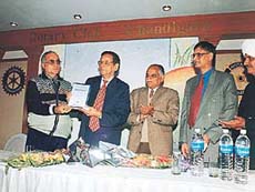Prof K.N. Pathak, Vice-Chancellor of Panjab University, releases a book ‘Practical Aspects of Service Law’ by H.C. Arora, in the Rotary Club, Sector 18, Chandigarh, on Saturday.