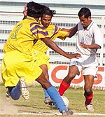 Assam State Electricity Board (white) and Jorba Durga Club, Orissa (yellow) in action during the 2nd Division National Football League at Ambedkar Stadium in the Capital on Wednesday.