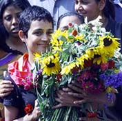 Booker prize winner Arundhati Roy receives flowers