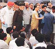 Sonia Gandhi, Leader of the Opposition, consoles a riot victim in Ahmedabad on Friday.