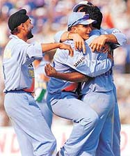 Captain Saurav Ganguly celebrates with Harbhajan Singh and teammates