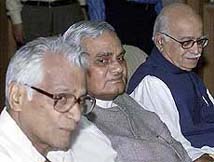 Prime Minister Atal Behari Vajpayee sits with Defence Minister George Fernandes and Home Minister L. K Advani