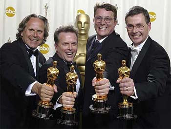 Jim Rygiel, Randall William Cook, Richard Taylor and Mark Stetson pose with their Oscar Trophies