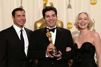 Bosnian director Danis Tanovic holds his Oscar