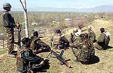 Soldiers rest during the siege of a mosque