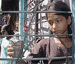 Fourteen-year-old Kavita Parmar holds a homemade bomb 