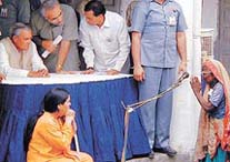 Prime Minister Atal Behari Vajpayee listens to the plight of a victim