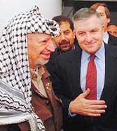Palestinian President Yasser Arafat talks to US envoy Anthony Zinni