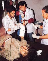 A man receives medical help at a hospital