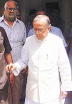 Leaders of the Peoples Front, Mr Jyoti Basu and Mr Somnath Chatterjee, come out after attending a meeting