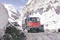 An Army convoy crosses the Zojila on way to Kargil as the 434-km-long Srinagar-Leh national highway was thrown open to vehicular traffic on Monday.