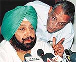 Punjab Chief Secretary Y.S. Ratra discusses a point with Chief Minister