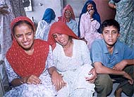 Grieving wife, daughter and son of Rajbeer Singh