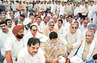 Congressmen and their leaders stage a dharna in front of the DC office in favour of agitating farmers at Jind on Monday. 
