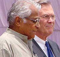 Union Defence Minister George Fernandes greets US Defence Secretary Donald Rumsfeld 