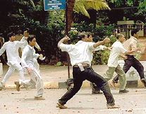 BJP-Shiv Sena activists pelting stones during a clash with NCP workers