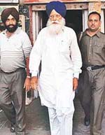 Former Education Minister Tota Singh being taken to the Kharar court 