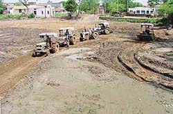 Residents of Mullanpur-Garibdas village do ‘kar sewa’ to put a village pond in order on Sunday.