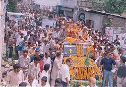 Mr Sukh Ram waves to the crowd during the annual foundation day of the party