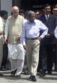 President A. P. J. Abdul Kalam and Deputy Prime Minister L. K. Advani come out from the AIIMS