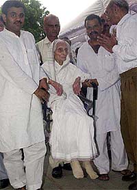 Mother of Vice-President Krishan Kant, Mrs Satyawati Devi, being carried on a chair