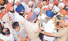 Policemen have a tough time controlling the crowd outside the Kharar Judicial Courts Complex at the time of the appearance of former Public Works Minister Sucha Singh Langah 